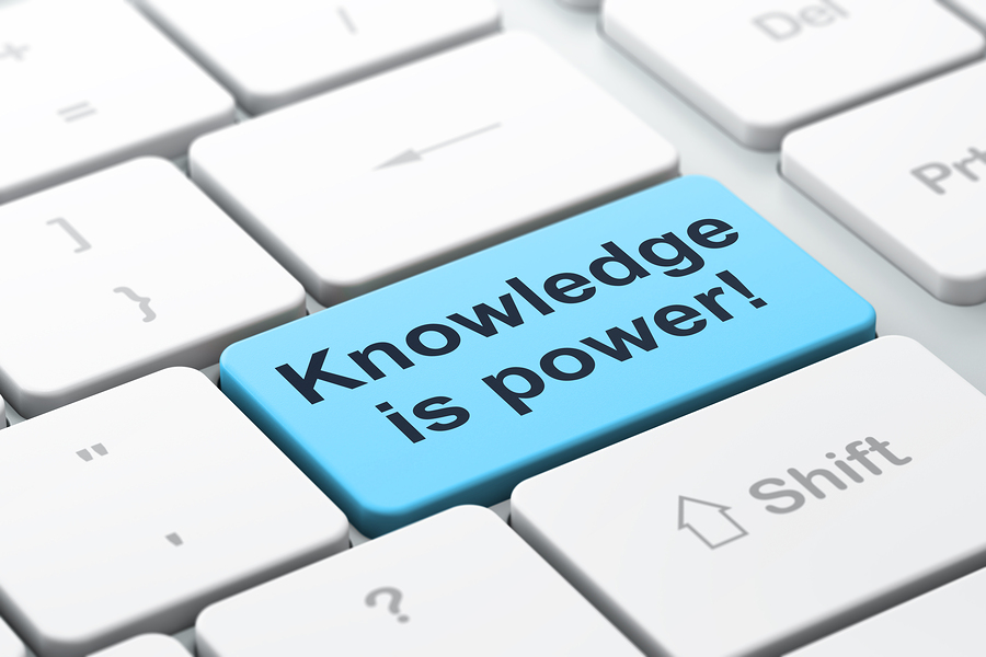 Education concept: Knowledge Is power! on computer keyboard back
